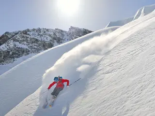 Spring sunshine meets skiing, yoga, picnics, and swimming in the Alps